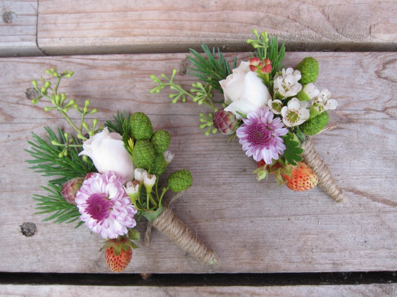Boutonnieres made with spray rose, lavender button mum, white waxflower, eucalyptus, spruce, wild strawberries and alder cones | designed by Natasha Price of alaskaknitnat.com