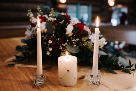 Altar centerpieces in burgundy and ivory | Designed by Natasha Price and photo by Grace Adams Photography