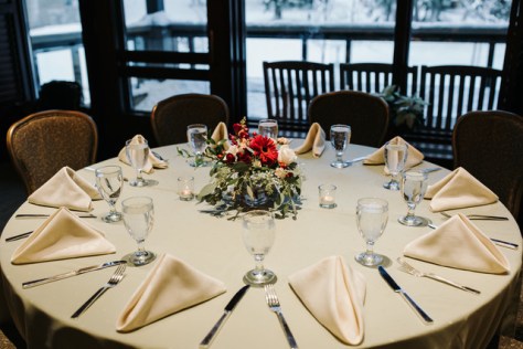 Red and white wintertime centerpiece designed by Natasha Price of Alaskaknitnat.com | Photo by Grace Adams Photography