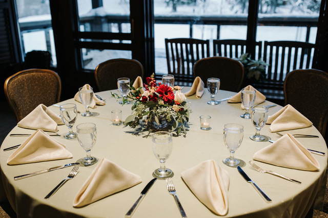 Red and white wintertime centerpiece designed by Natasha Price of Alaskaknitnat.com | Photo by Grace Adams Photography