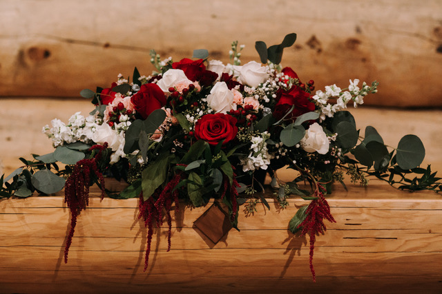 Altar centerpieces in burgundy and ivory | Designed by Natasha Price and photo by Grace Adams Photography