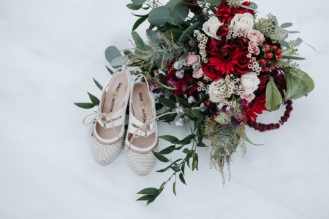 Red and white wintertime bouquet designed by Natasha Price of Alaskaknitnat.com | Photo by Grace Adams Photography