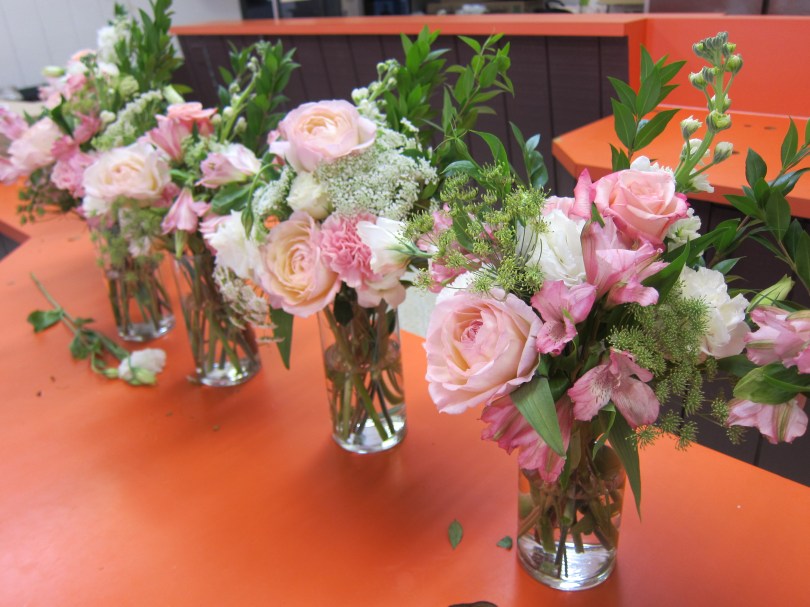 Wedding centerpieces made with blush garden roses, lisianthus, carnations, queen anne's lace, stock, alestroemeria and myrtle | Wedding flowers designed by Natasha Price of Alaskaknitnat.com