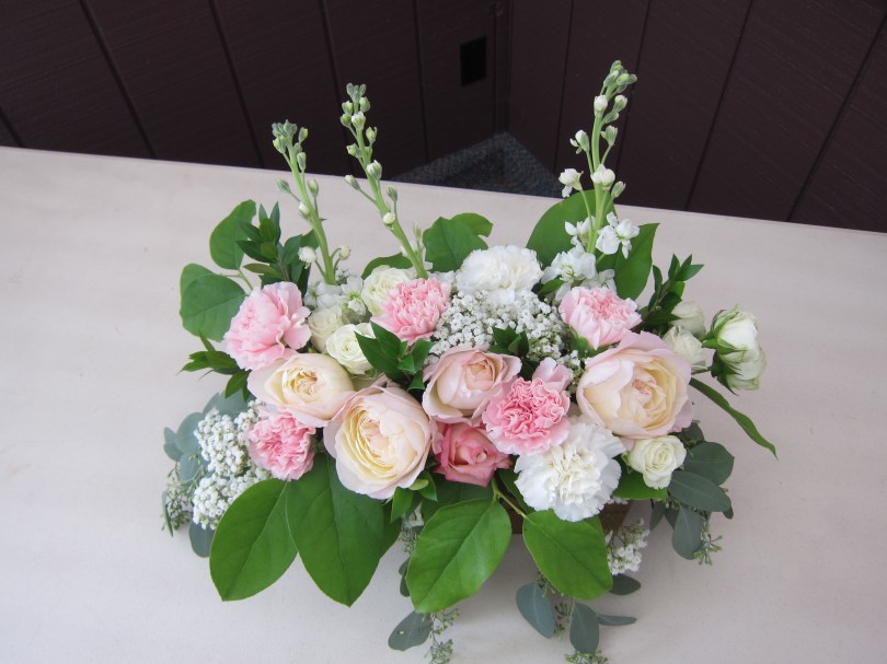 Wedding centerpieces made with blush garden roses, lisianthus, carnations, queen anne's lace, stock, alestroemeria and myrtle | Wedding flowers designed by Natasha Price of Alaskaknitnat.com