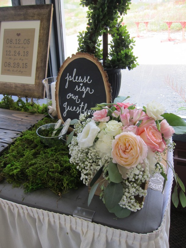 Wedding centerpieces made with blush garden roses, lisianthus, carnations, queen anne's lace, stock, alestroemeria and myrtle | Wedding flowers designed by Natasha Price of Alaskaknitnat.com