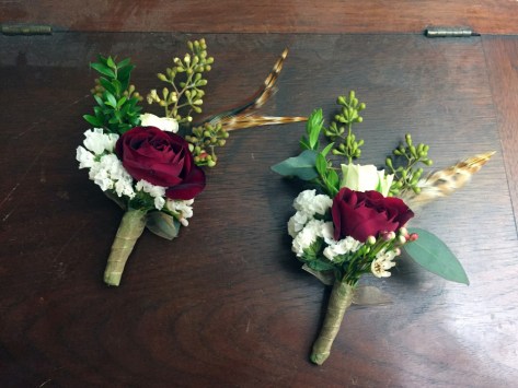 Alaska Winter Wedding | eucalyptus, spray rose, white statice, mini myrtle and a touch of feathers make an elegant, festive boutonnière. Designed by Natasha Price from alaskaknitnat.com