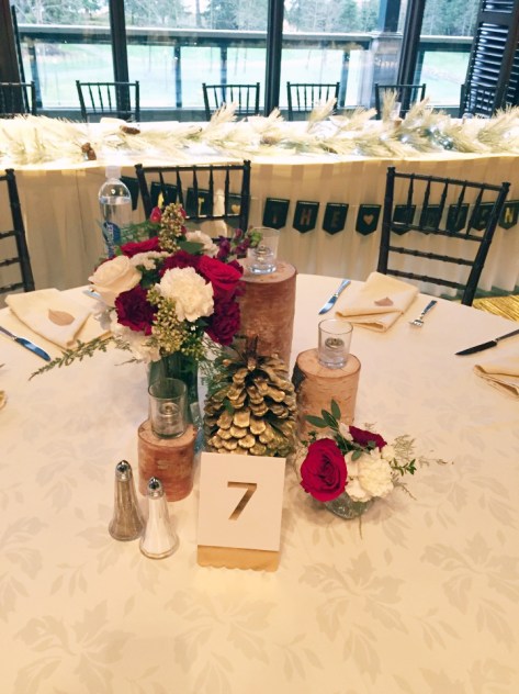 Alaska Winter Wedding | White and red roses, white and burgundy carnations, eucalyptus, red snapdragon, red hypericum, plumosa and spray roses. The perfect holiday centerpiece from alaskaknitnat.com