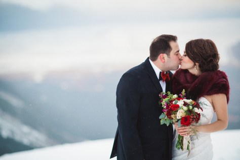 Alaska Winter Wedding | White and red roses, white and burgundy carnations, eucalyptus, red snapdragon, red hypericum, plumosa and spray roses. The perfect holiday bouquet from alaskaknitnat.com