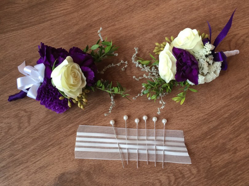 Alaska Winter Wedding | corsages made with white spray roses, statice, sage, mini myrtle, eucalyptus and purple mini carnations. Designed by Natasha Price of Alaskaknitnat.com