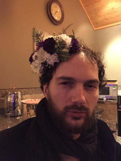 Alaska Winter Wedding | flower crown made with white spray roses, statice, mini myrtle, waxflower, Sitka spruce, eucalyptus and purple mini carnations. Designed by Natasha Price of Alaskaknitnat.com