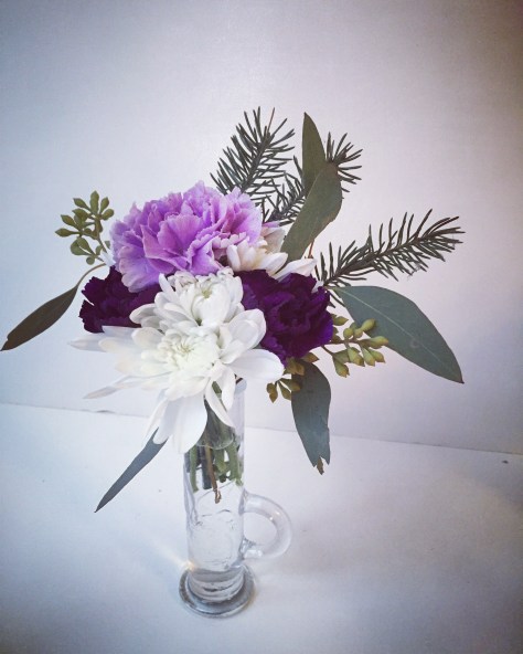 Winter Weddings: Purple carnations, white chrysanthemums, spruce sprigs and eucalyptus create a soft, festive look for any winter celebration | designed by Natasha Price of Alaskaknitnat.com