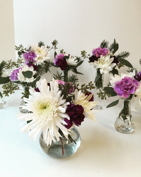 Winter Weddings: Purple carnations, white chrysanthemums, spruce sprigs and eucalyptus create a soft, festive look for any winter celebration | designed by Natasha Price of Alaskaknitnat.com
