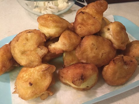 Moña's fried cauliflower | florets coated in a delicate egg batter, pan fried and tossed in a tomato sauce. It's the perfect side dish for any Mexican meal. Recipe from Alaskaknitnat.com