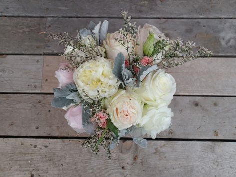 Wedding bouquet with peonies, garden roses, lisianthus, spray roses, limonium, salal and seeded eucalyptus | a romantic flower arrangement with a soft palate, designed by Natasha Price of Alaskaknitnat.com