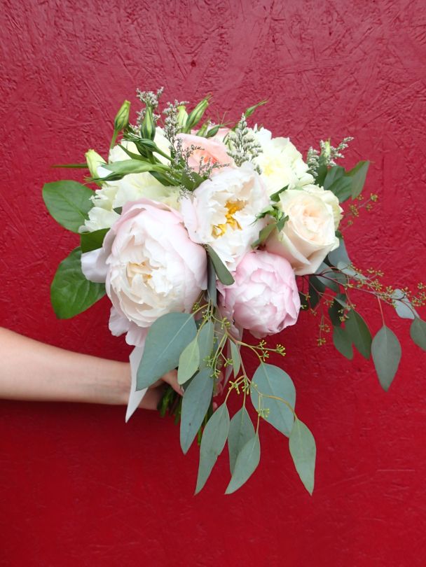 Bridal bouquet with peonies, garden roses, lisianthus, spray roses, limonium, salal and seeded eucalyptus | a romantic flower arrangement with a soft palate, designed by Natasha Price of Alaskaknitnat.com