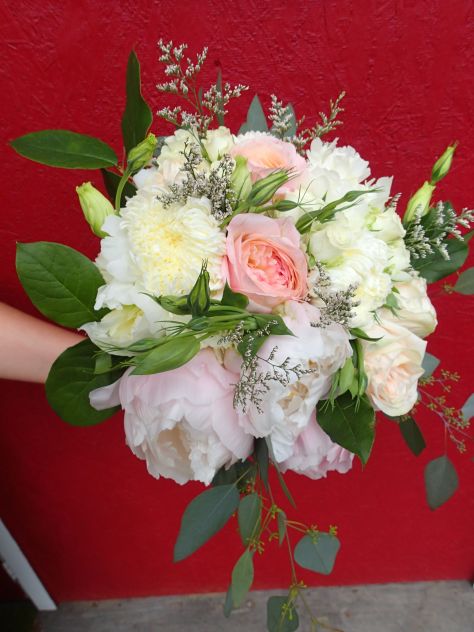 Bridal bouquet with peonies, garden roses, lisianthus, spray roses, limonium, salal and seeded eucalyptus | a romantic flower arrangement with a soft palate, designed by Natasha Price of Alaskaknitnat.com