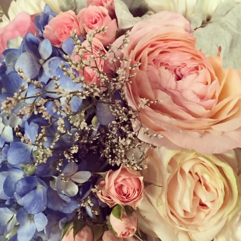Garden roses, blue hydrangea, lisianthus, baby's breath limonium, seeded eucalyptus and dusty miller | Such a romantic, soft palate for a June wedding. Designed by Natasha Price of Alaskaknitnat.com