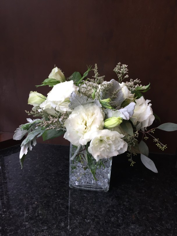 Centerpieces made with lisianthus, dusty miller, limonium and seeded eucalyptus | Wedding flowers designed by Natasha Price of Alaskaknitnat.com