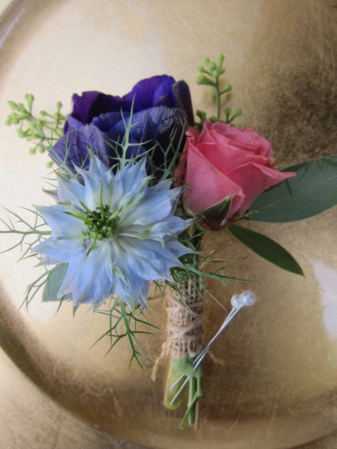 Boutonniere made with nigella, purple anemone, spray rose and seeded eucalyptus | designed by Natasha Price of Alaksaknitnat.com