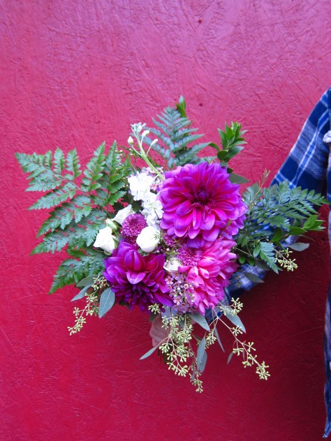 A stunning wedding bouquet with a dinner plate dahlia, gold eucalyptus, ferns, myrtle, waxflower and spray roses | Designed by Natasha Price of alaskaknitnat.com