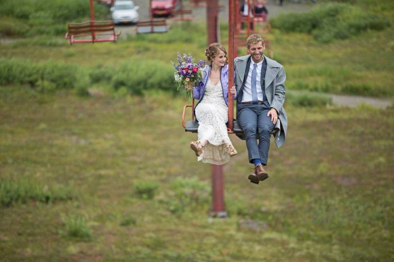 Bridal bouquet made with purple anemones, fuchsia ranunculus, blue nigella, purple larkspur, daisies, baby's breath, pink spray roses and seeded eucalyptus | designed by Natasha Price of Alaskaknitnat.com