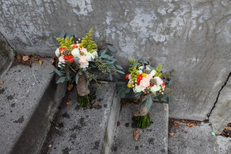 A perfect fall bridal bouquet. Solidago, white roses, orange spray roses, salmon hypericum berry, billy ball, scabiosa pods, peach carnation and seeded eucalyptus wrapped in burlap with jute twine corset | designed by Natasha Price of alaskaknitnat.com