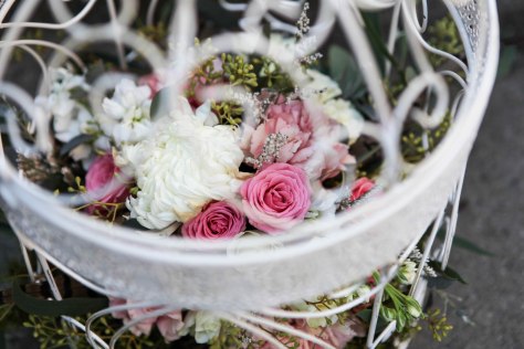 Birdcage flower arrangement for a fairy tale wedding. Made with eucalyptus, carnations, football mums, roses, stock and spray roses | designed by Natasha Price of Alaskaknitnat.com