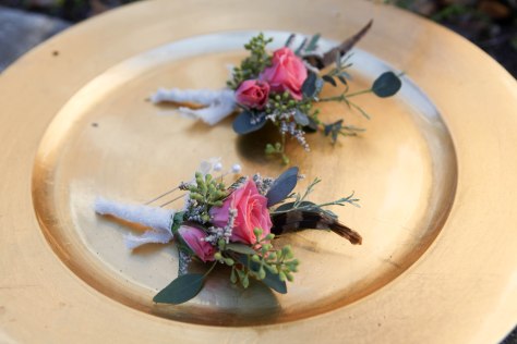Shabby chic wedding boutonnieres made with limonium, eucalyptus, feathers and spray roses | Designed by Natasha Price of alaskaknitnat.com