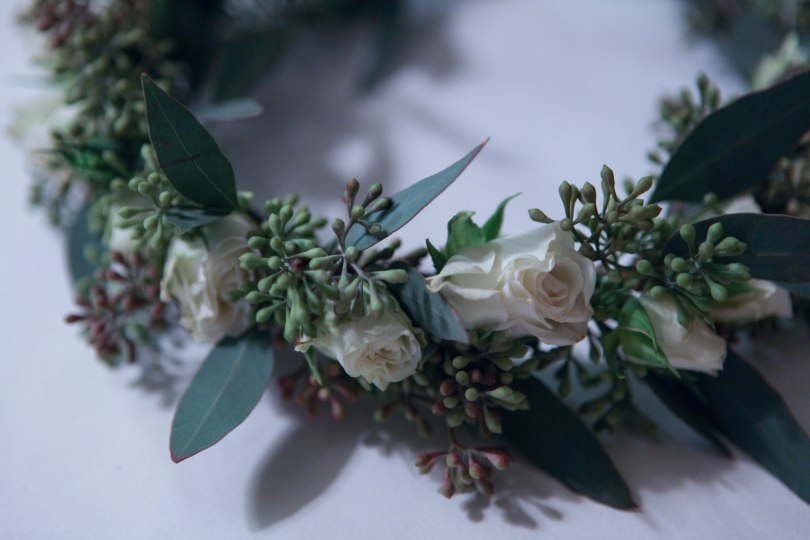 Flower crown made with seeded eucalyptus and white spray roses | designed by Natasha Price of alaskaknitnat.com