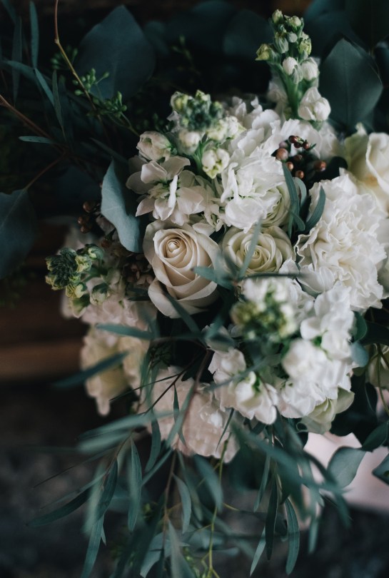 The perfect winter wedding bouquet | roses, stock, waxflower and carnation mixed with eucalytpus. Flowers by Natasha Price and photo by Erica Rose Photography