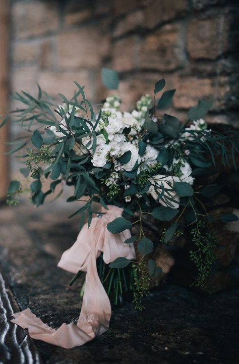 The perfect winter wedding bouquet | roses, stock, waxflower and carnation mixed with eucalytpus. Flowers by Natasha Price and photo by Erica Rose Photography