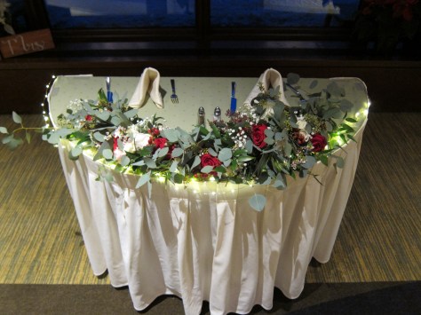 Sweetheart table garland made with roses, waxflower, hypericum berry, baby's breath and eucalyptus | designed by Natasha Price