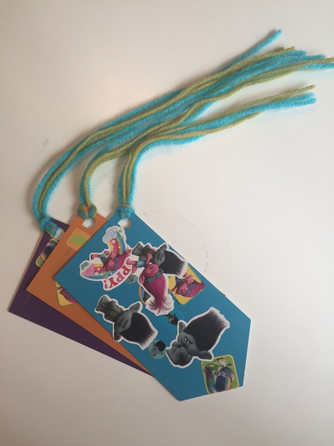 Paint chip bookmarks | All you need is stickers, yarn and free paint chips. A great craft for toddlers!